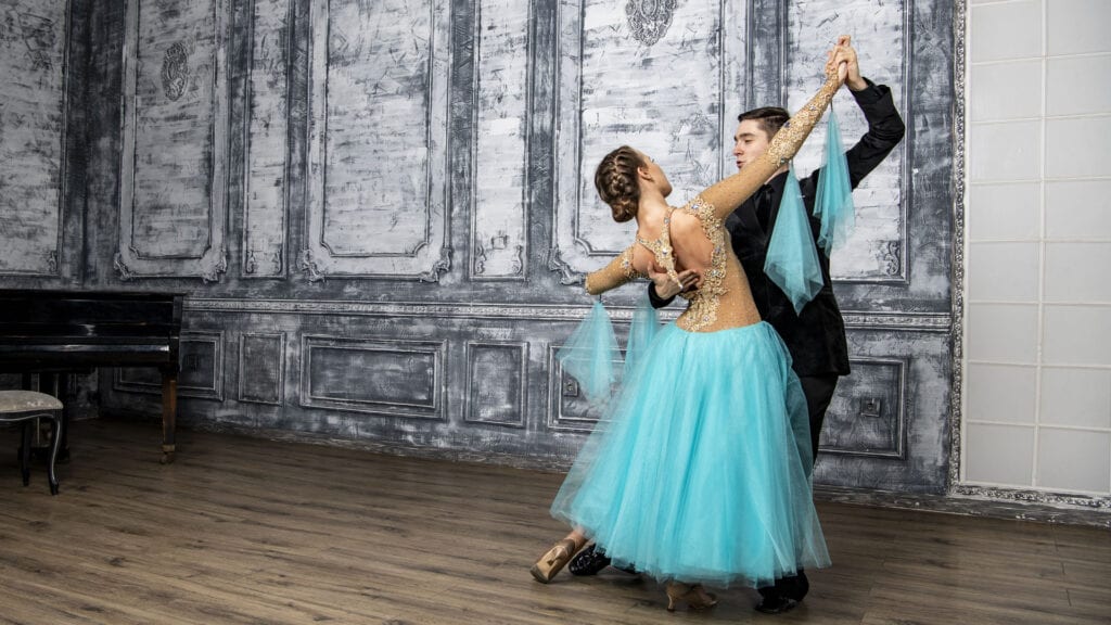 Two students learning how to waltz at World Champion's dance lessons for beginners in Nashville